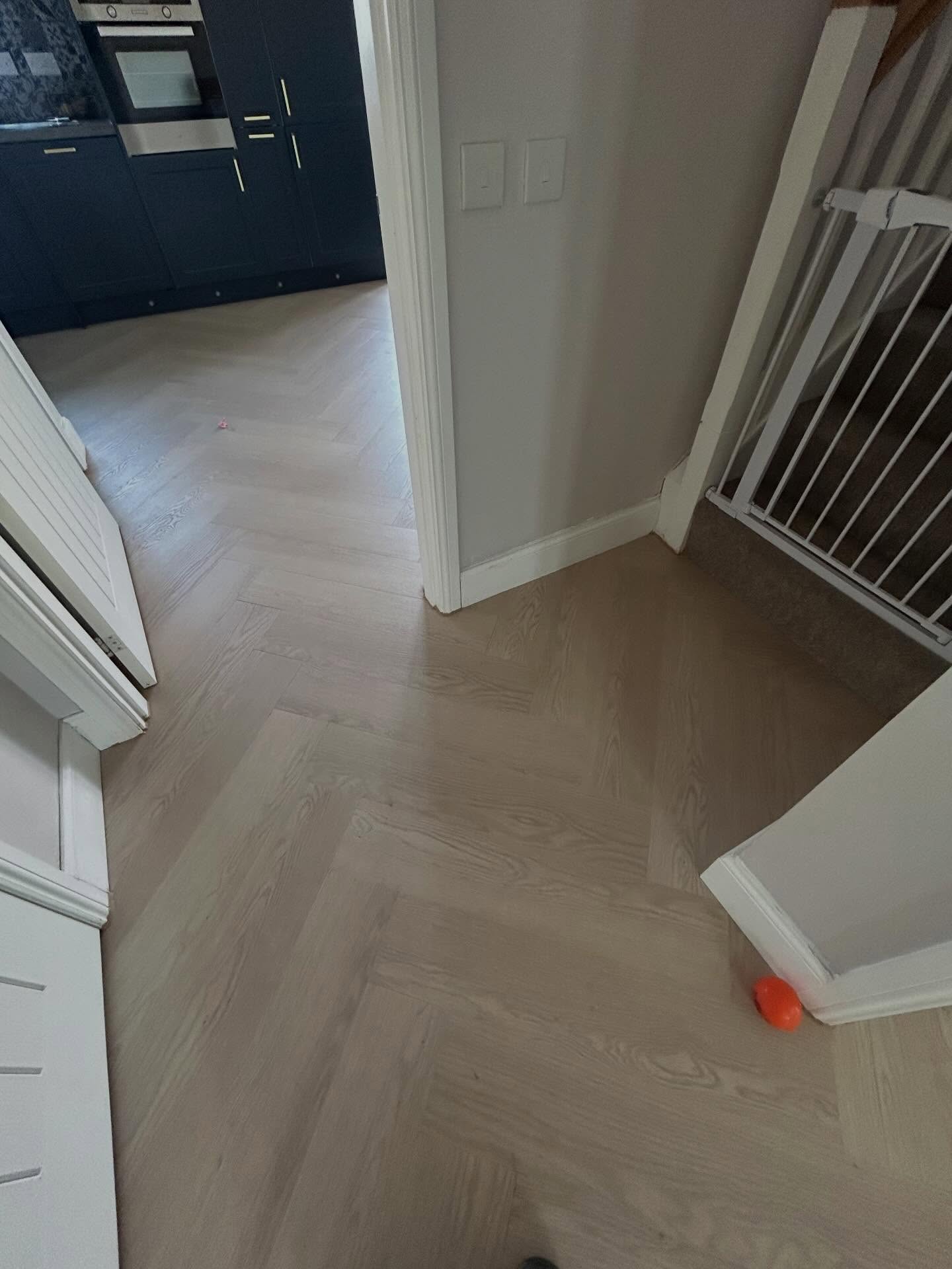 Completed continuous herringbone floor installation